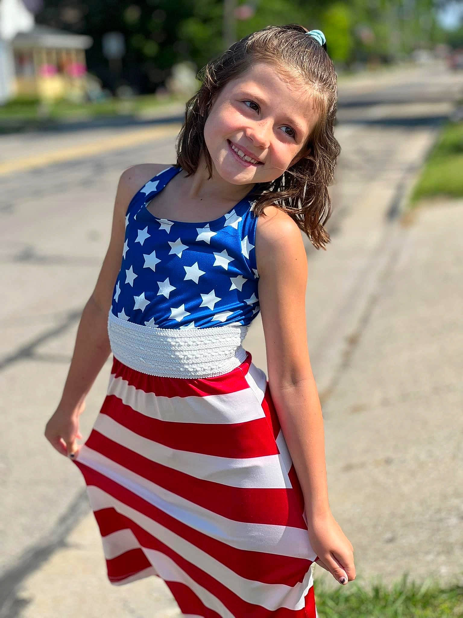 Constance is registered to the contest to win money with this photo: abdomen, day_dress, dress, electric_blue, eye, face, formal_wear, grass, hair, happy, head, human_body, joy, knee, leisure, neck, person, plant, smile, thigh