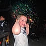 Giuliann participe au concours pour gagner de l'argent avec cette photo : child, boy, fireworks, night, celebration, bicycle, people, outdoor, ear_covering, festive, light, darkness, smiling, short_hair, white_shirt, shorts, fun, event, crowd, street