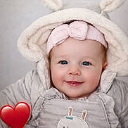 Louna participe au concours pour gagner de l'argent avec cette photo : adorable, baby, blue_eyes, child, closeup, cozy, cute, face, fluffy_ears, happy, headband, hooded_jacket, indoor, infant, pink_bow, portrait, red_heart_emoji, smiling, soft_texture, warm_clothing