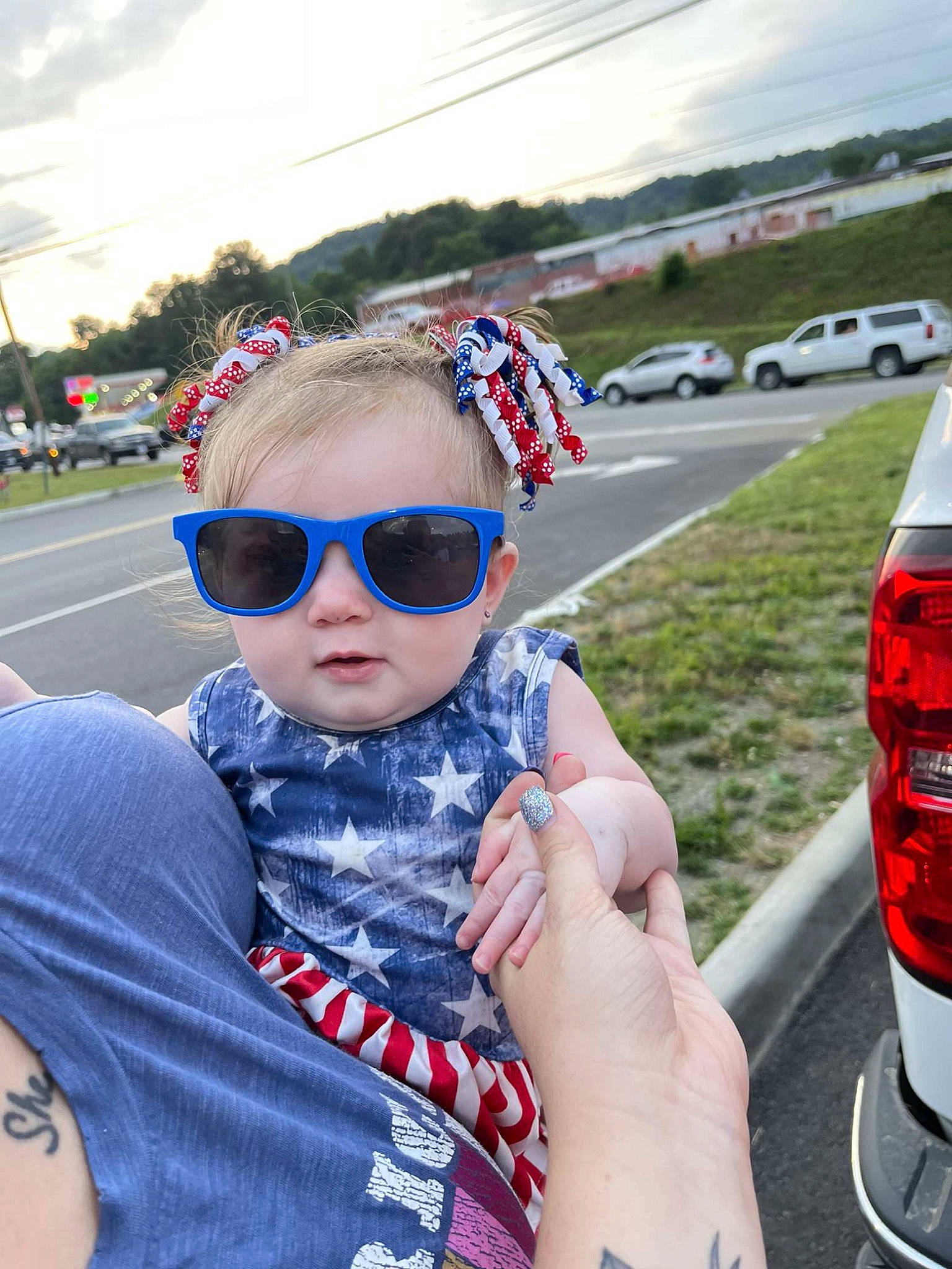 Kaisley is registered to the contest to win money with this photo: asphalt, automotive_lighting, cloud, eyewear, face, glasses, goggles, hand, happy, headgear, person, personal_protective_equipment, public_space, recreation, red, sky, street_fashion, summer, sunglasses, toddler