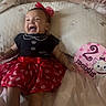 Nazaria joined the competition — help win amazing prizes! baby, smiling, infant, red_skirt, black_top, headband, pillow, bedding, bed, cute, happy, indoors, child, lying_down, celebration, months, cartoon, pink, sock, portrait