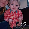 Rodger is registered to the contest to win money with this photo: child, adult, toddler, smile, red_checkered_shirt, blue_eyes, indoor, couch, curtains, flooring, string, holding, happy, portrait, person, casual_clothing, blue_led_lights, home, time_stamp, text_overlay