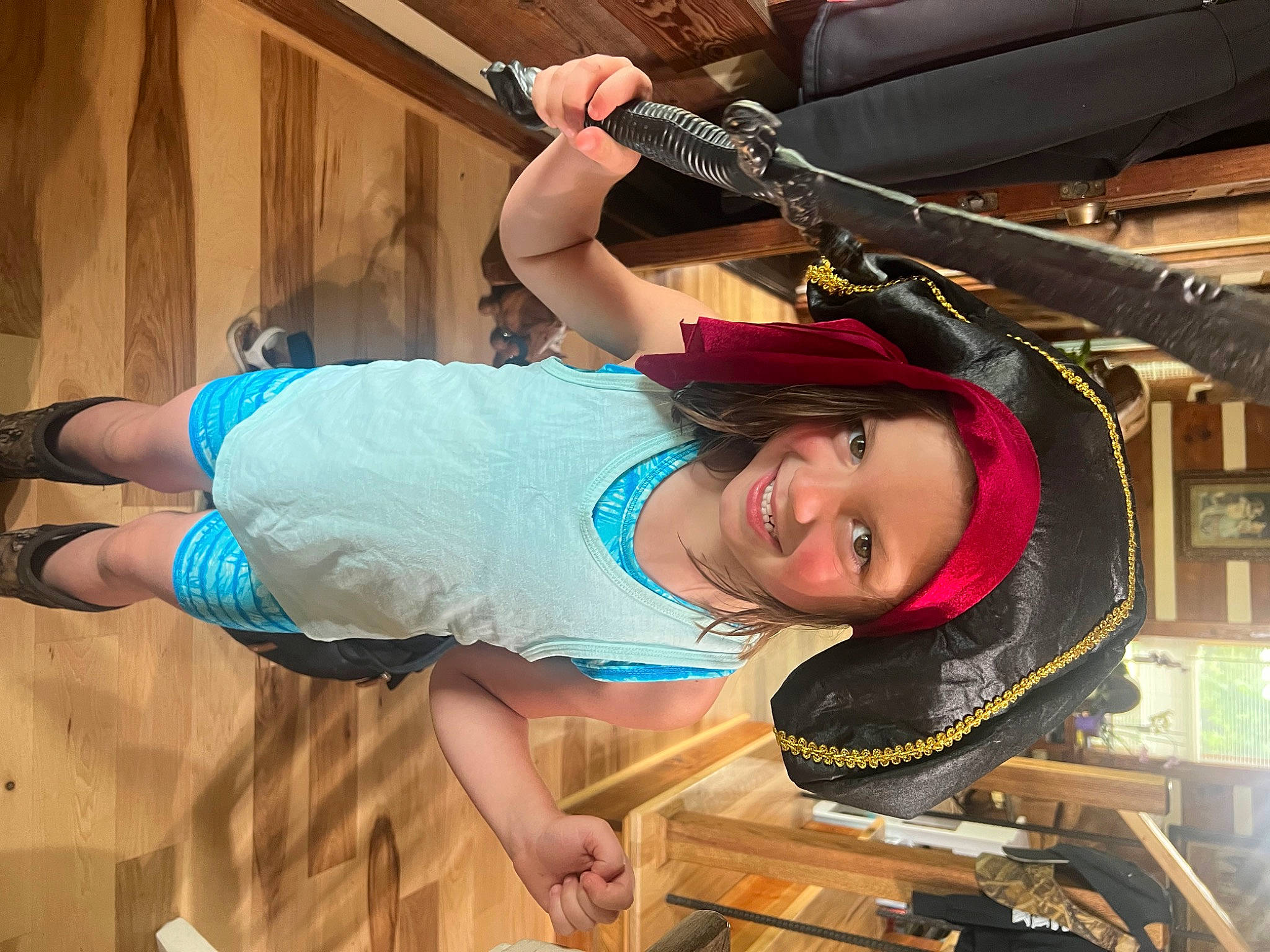 Kenzlee is registered to the contest to win money with this photo: abdomen, auto_part, automotive_tire, electric_blue, fashion_accessory, fun, happy, hat, headwear, helmet, human_leg, joy, leisure, person, personal_protective_equipment, recreation, sandal, shorts, smile, sportswear