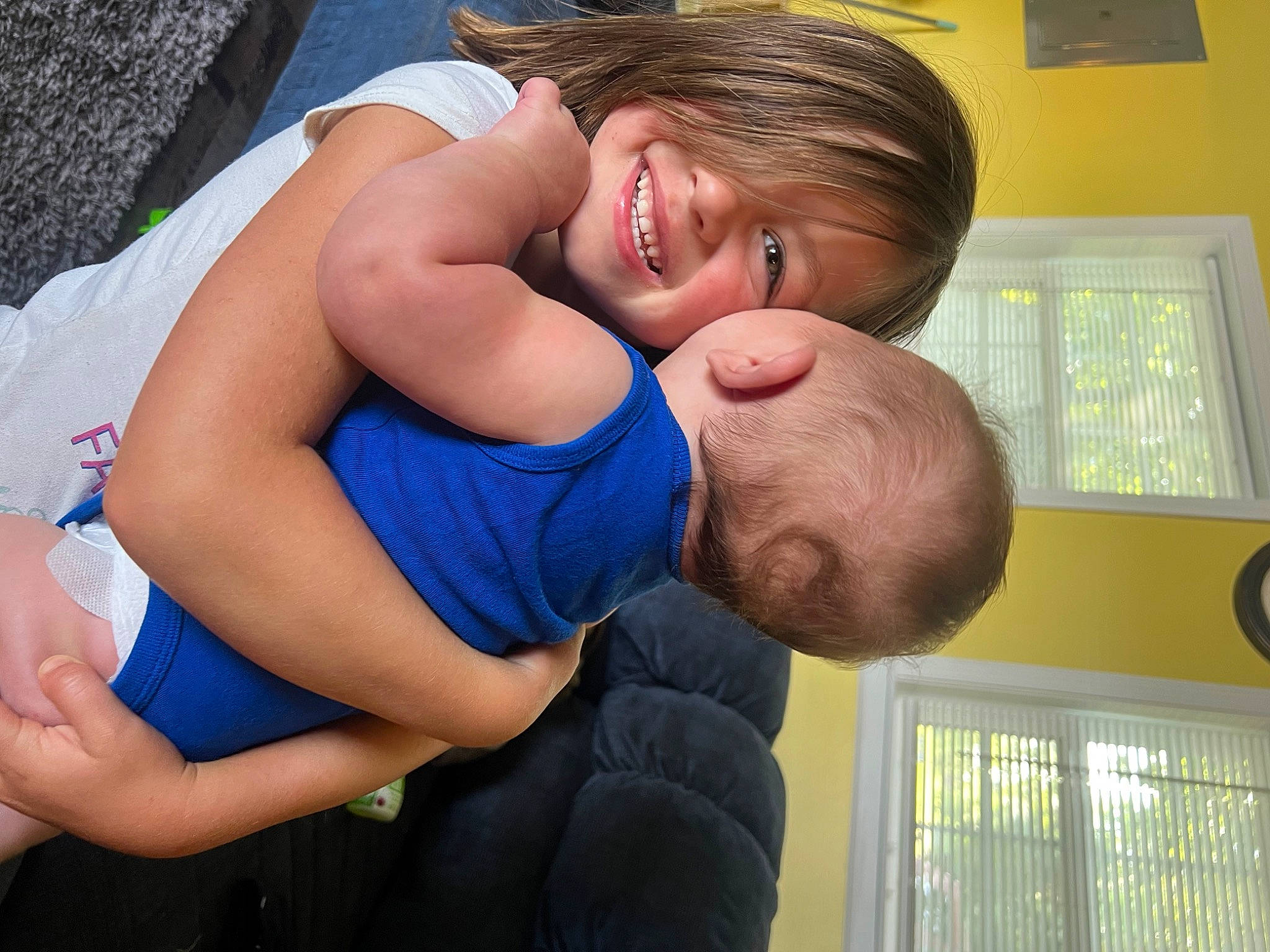 Kenzlee is registered to the contest to win money with this photo: abdomen, arm, baby, chest, child, elbow, electric_blue, event, finger, fun, gesture, happy, hug, human_leg, joint, joy, person, smile, thigh, toddler