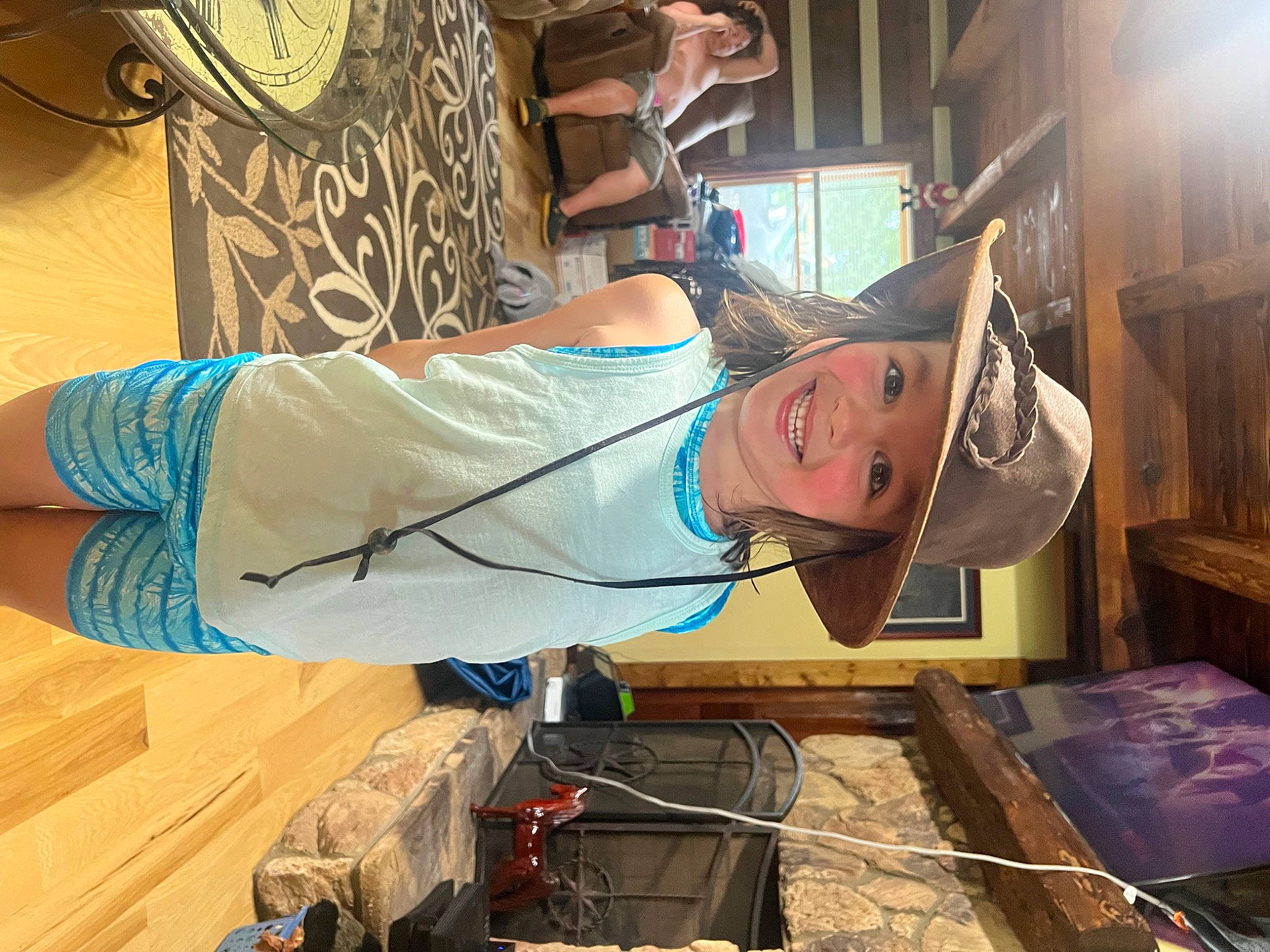 Kenzlee is registered to the contest to win money with this photo: artist, baseball_cap, cap, elbow, engineering, eyewear, fun, gas, hat, headwear, joy, machine, person, room, t_shirt, window, wood