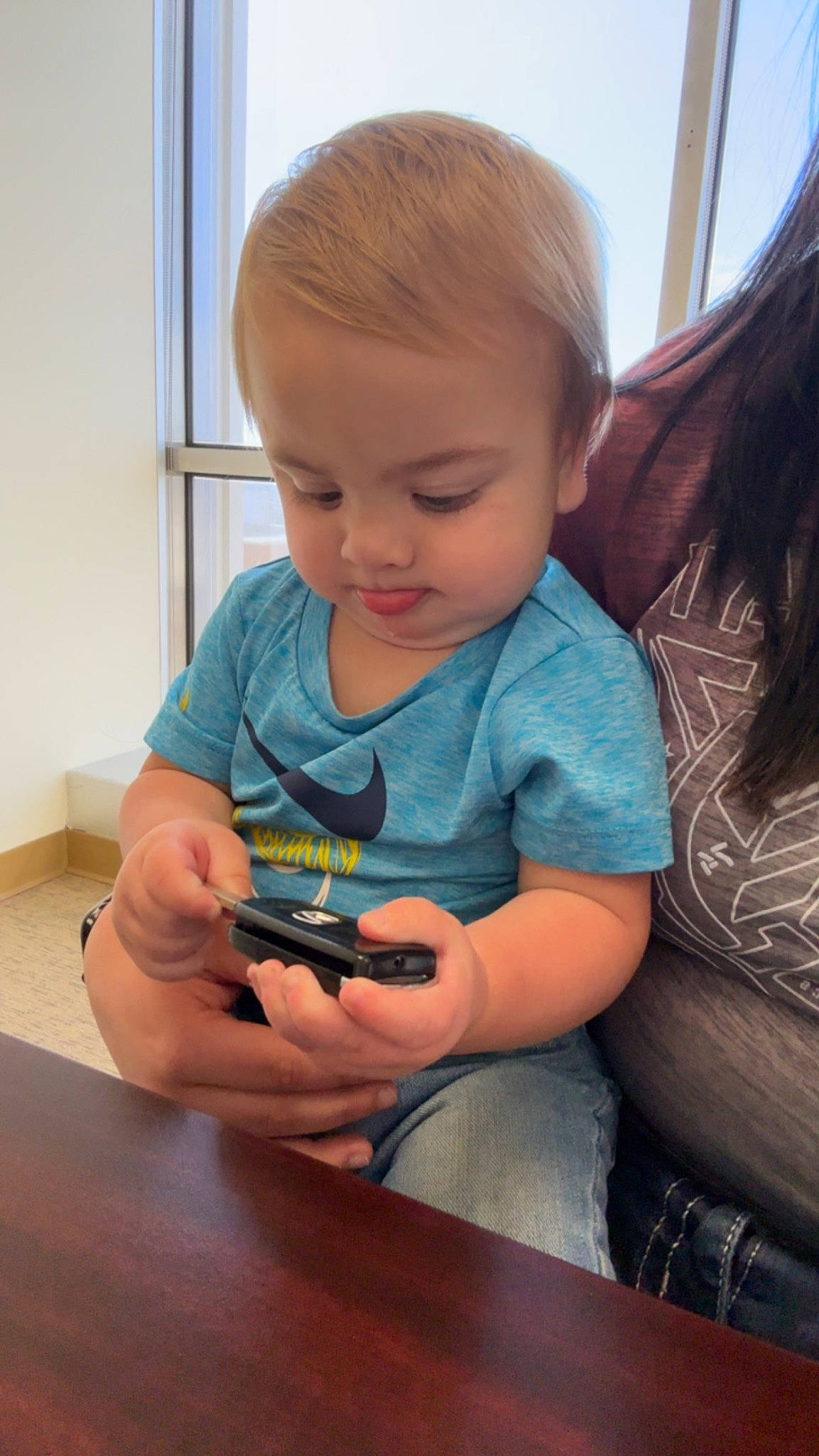 Benson joined the competition — help win amazing prizes! arm, baby, cheek, child, finger, flooring, fun, hand, happy, iris, mouth, nail, nose, person, sitting, skin, t_shirt, table, thumb, toddler