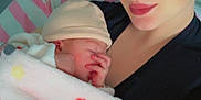 Théa a rejoint le concours — aidez-le/la à gagner de superbes lots ! architecture, baby, bed, blanket, bonnet, building, cap, clothing, cosmetics, face, furniture, glove, hat, head, hospital, lipstick, newborn, person, photography, portrait