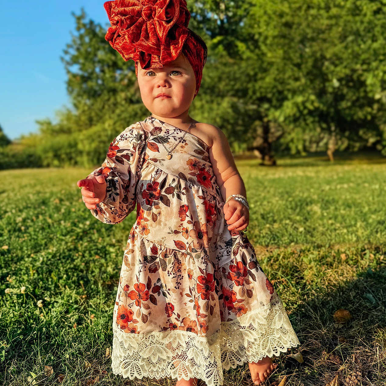 Skyler is registered to the contest to win money with this photo: child, clothing, dress, face, fashion, female, formalwear, girl, gown, grass, hair, head, lady, person, photography, plant, portrait, sitting, sleeve, standing