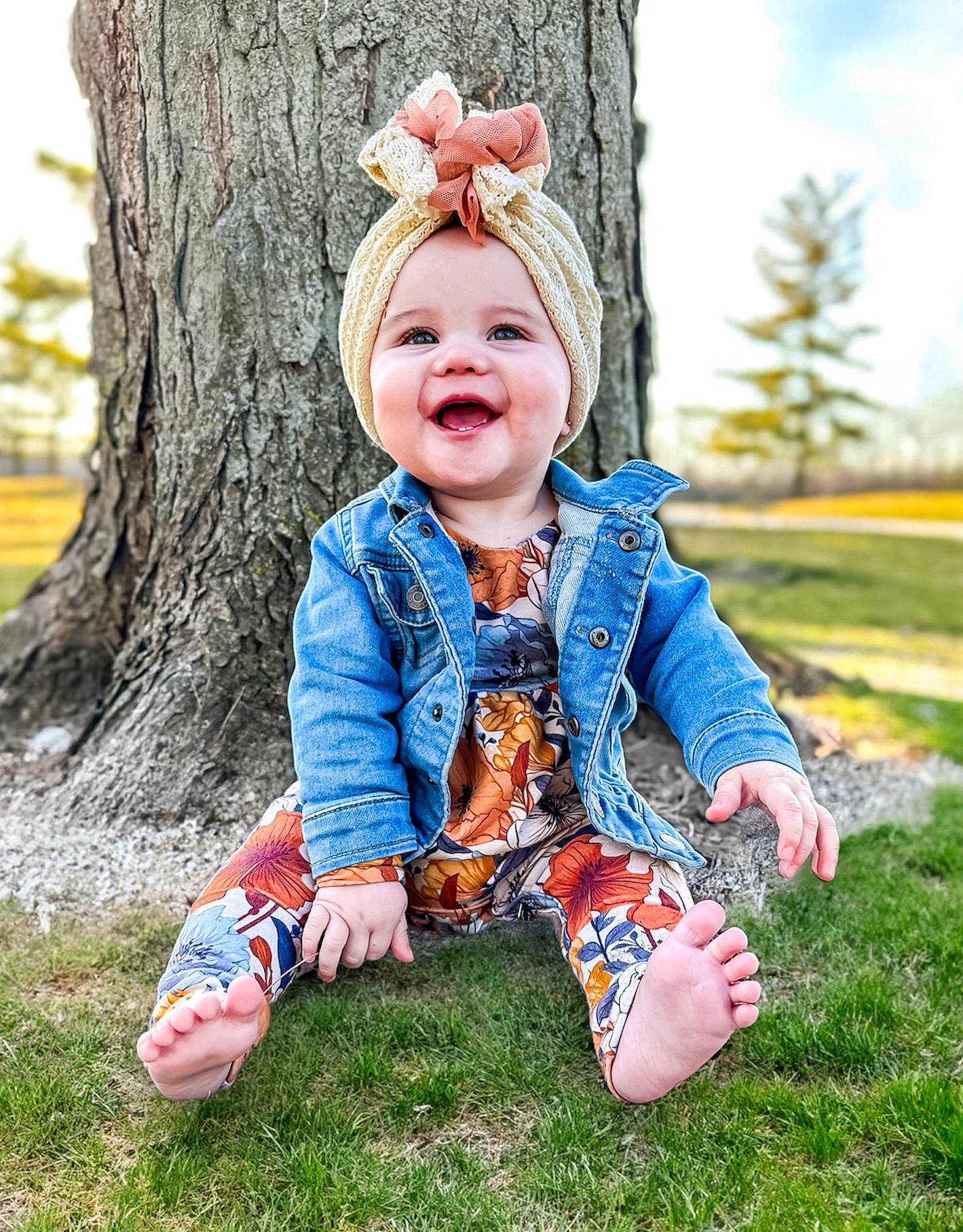 Skyler is registered to the contest to win money with this photo: baby, baby_toddler_clothing, child, fun, grass, happy, jacket, joy, laugh, leisure, pattern, people_in_nature, person, plant, recreation, sitting, sky, sleeve, smile, standing