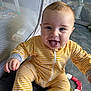 Waylon joined the competition — help win amazing prizes! baby, child, smiling, tongue_out, striped_clothing, yellow, onesie, toy, playpen, carpet, indoor, cute, happy, infant, sitting, face, hand, blue_eyes, light_hair, playtime