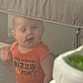 Waylon joined the competition — help win amazing prizes! baby, child, mesh, playpen, orange_shirt, indoor, curious, face, expression, mesh_fabric, hand, standing, clothing, person, infant, cute, young, looking, mesh_pattern, zipper