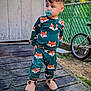toddler, child, pacifier, pajamas, fox_pattern, slippers, outdoor, deck, wooden, fence, bicycle, shed, grass, clothing, footwear, standing, portrait, cute, casual, daytime