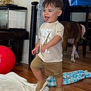 Isaac joined the competition — help win amazing prizes! blanket, child, clothing, dog, furniture, happy, home, indoor, nike, person, pet, playful, red_ball, shoes, shorts, smiling, toddler, tongue_out, tshirt, wooden_floor