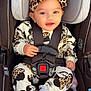baby, child, car_seat, graco, headband, leopard_print, smiling, socks, straps, seatbelt, infant, cute, clothing, patterned_outfit, happy, portrait, indoor, child_seat, comfort, safety