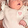 Brianna joined the competition — help win amazing prizes! baby, infant, headband, white_clothing, pink_pants, heart_symbol, plush_blanket, soft_texture, cute, chubby_cheeks, portrait, child, clothing, lying_down, expression, wide_eyes, hand, indoor, closeup, adorable
