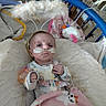 Kinzlee joined the competition — help win amazing prizes! baby, infant, hospital, crib, blanket, medical_tubes, headband, angel_halo, pink, cute, ghosts, spider_webs, toys, medical_equipment, person, child, bed, clothing, indoors, healthcare
