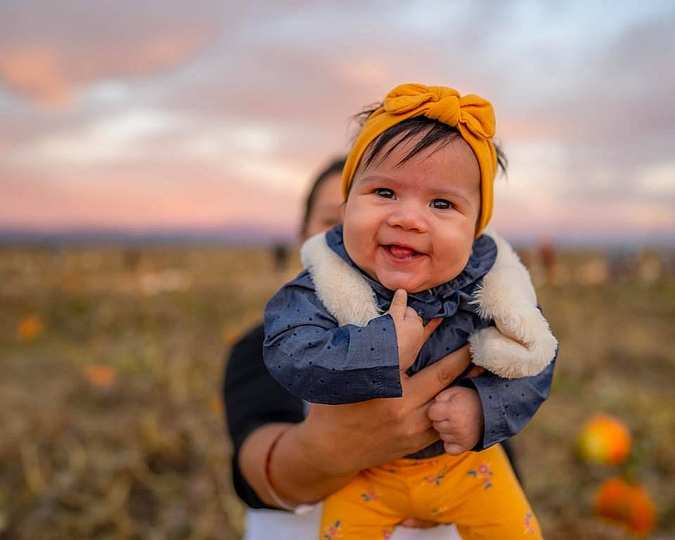 Elora joined the competition — help win amazing prizes! baby, baby_toddler_clothing, child, cloud, eye, face, flash_photography, fun, grass, grassland, happy, headwear, joy, landscape, leisure, people_in_nature, person, personal_protective_equipment, plant, sky