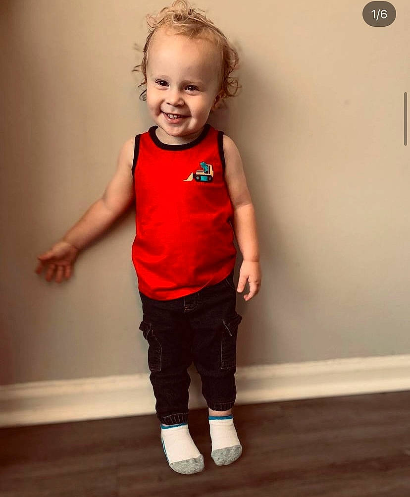Rhett joined the competition — help win amazing prizes! arm, baby_toddler_clothing, eye, face, flash_photography, floor, flooring, gesture, hand, happy, joint, joy, knee, person, skin, sleeve, smile, standing, t_shirt, waist