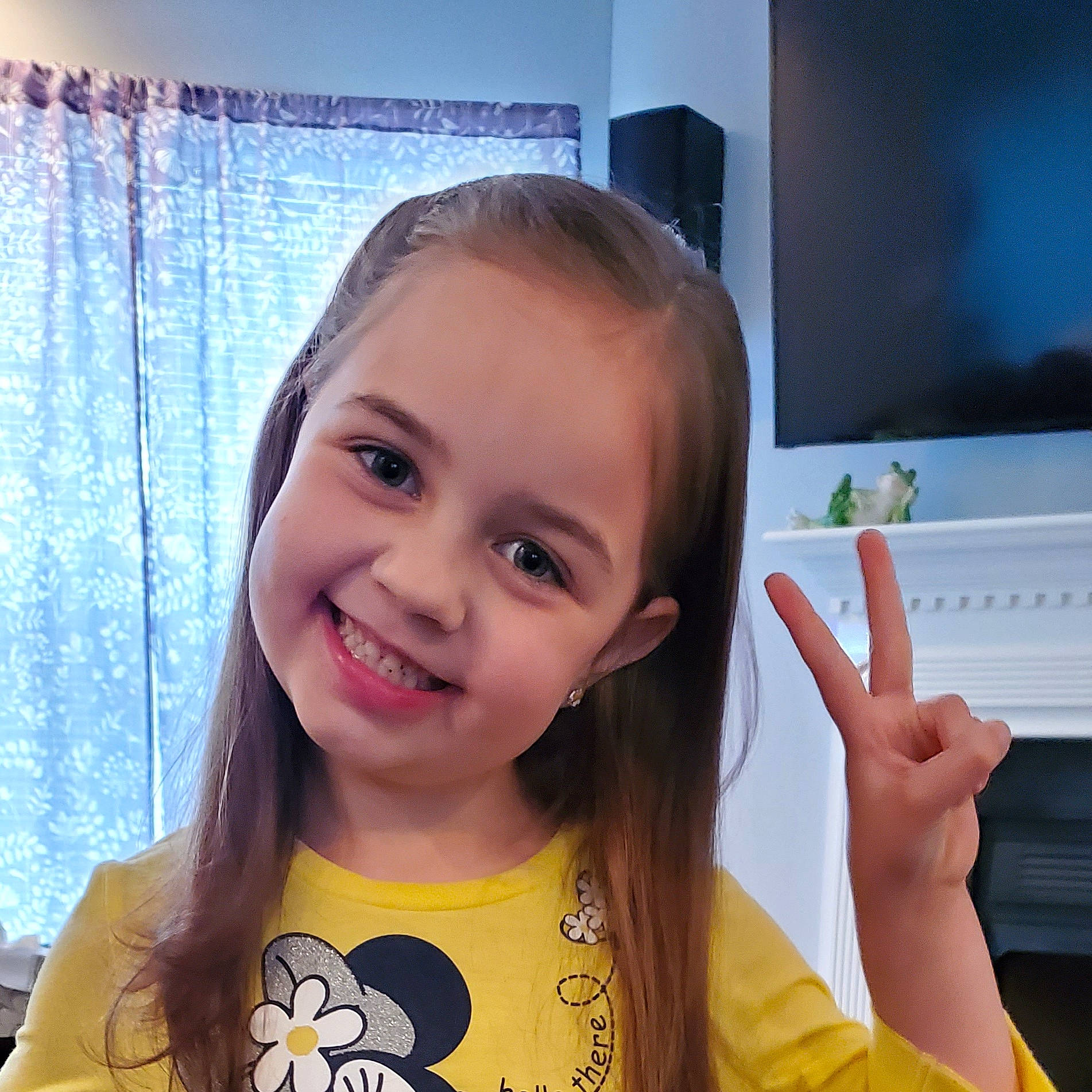 Ava is registered to the contest to win money with this photo: baby_toddler_clothing, curtain, display_device, eye, eyebrow, eyelash, finger, flat_panel_display, gesture, happy, iris, joy, nail, person, television, television_accessory, television_set, thumb, toddler, tooth