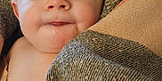 Daniel joined the competition — help win amazing prizes! adult, baby, blanket, child, closeup, comfort, cozy, drool, expression, face, happy, head, human, indoor, person, portrait, skin, smile, warm, wrapped