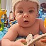 Daniel is registered to the contest to win money with this photo: arm, baby, bunny_hat, child, closeup, curious, cuteness, expression, eyes, face, hand, headwear, indoor, infant, play_area, plush_toy, skin, soft_lighting, toy, wide_eyes