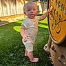 Emerson joined the competition — help win amazing prizes! toddler, child, barefoot, outdoor, playground, grass, toy, fence, trees, sunlight, summer, curious, standing, shorts, smiling_faces_pattern, play, nature, daytime, person, young_child