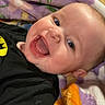 Emerson joined the competition — help win amazing prizes! baby, child, smiling, blanket, colorful, happy, portrait, indoor, closeup, face, cute, infant, toddler, cozy, expression, joyful, person, head, clothing, warmth