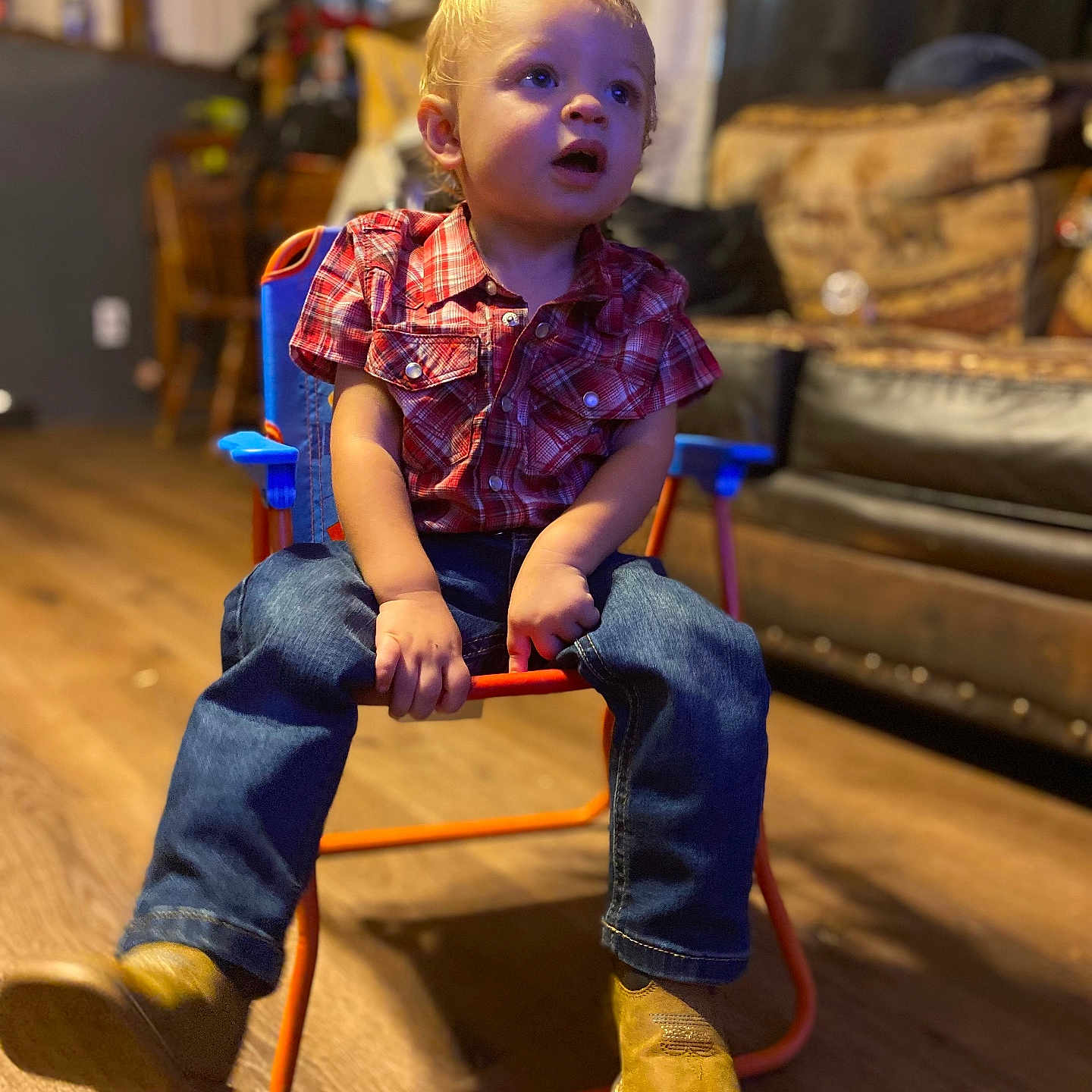 Hunter joined the competition — help win amazing prizes! boy, chair, child, clothing, couch, face, footwear, furniture, hardwood, head, indoors, jeans, male, pants, person, photography, portrait, shoe, sitting, wood