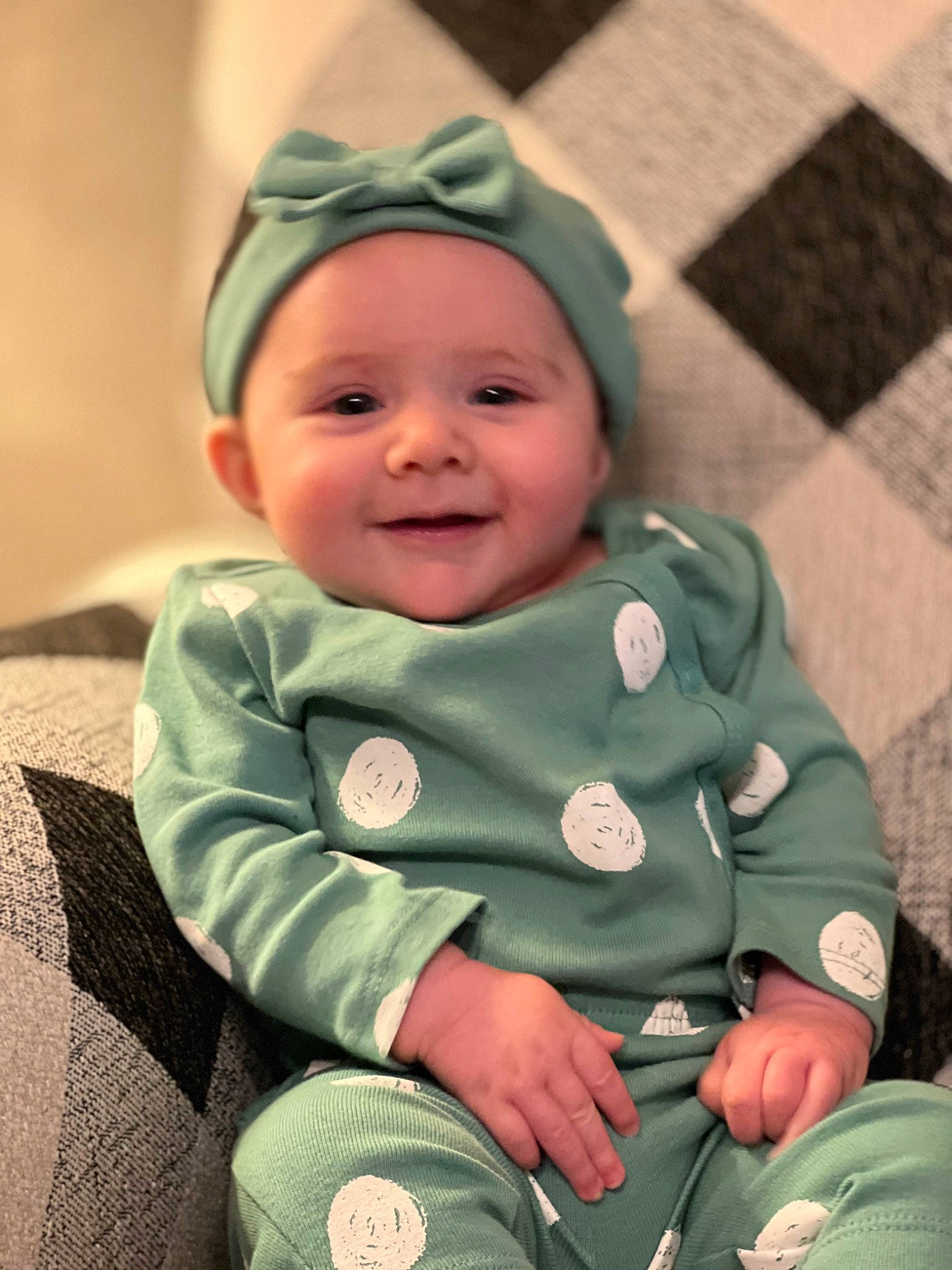 Taelynn is registered to the contest to win money with this photo: baby, baby_laughing, baby_products, baby_toddler_clothing, cap, cheek, comfort, eye, gesture, grass, happy, head, headwear, human_body, iris, joy, lip, nose, person, skin