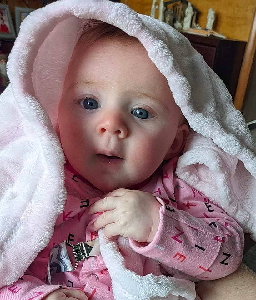 Taelynn is registered to the contest to win money with this photo: baby, baby_toddler_clothing, cap, cheek, child, chin, dress, eye, eyebrow, eyelash, face, head, human_body, iris, lip, nose, person, pink, skin, sleeve