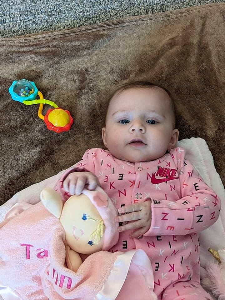 Taelynn is registered to the contest to win money with this photo: baby, baby_products, baby_toddler_clothing, baby_toys, cheek, child, comfort, doll, happy, head, linens, pattern, person, pink, product, sitting, skin, textile, toddler, toy