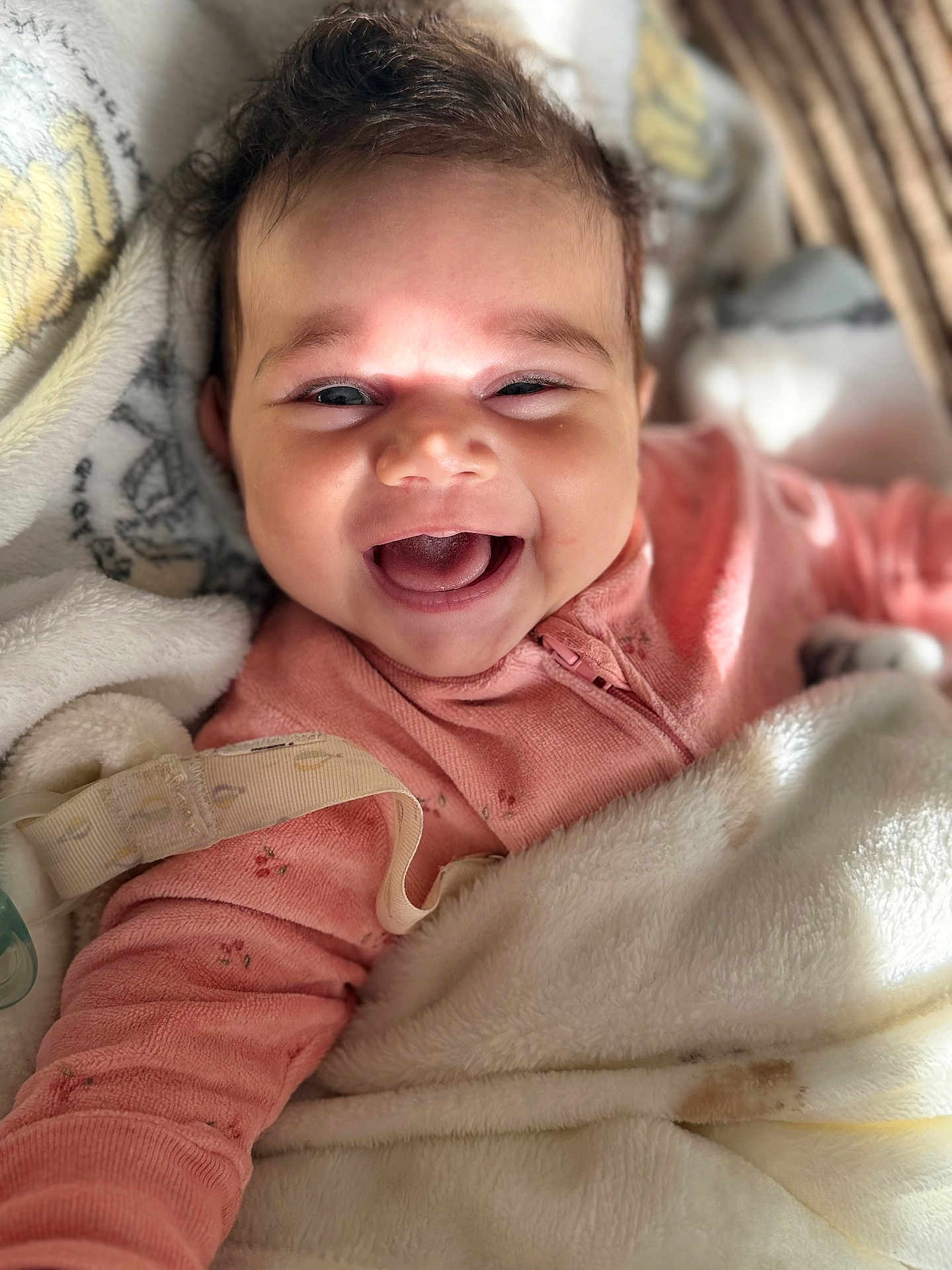 Taliah joined the competition — help win amazing prizes! baby, smiling, happy, blanket, pink_clothing, infant, face, cute, portrait, cozy, child, indoors, closeup, expression, warm, soft, relaxed, joy, sleepwear, adorable