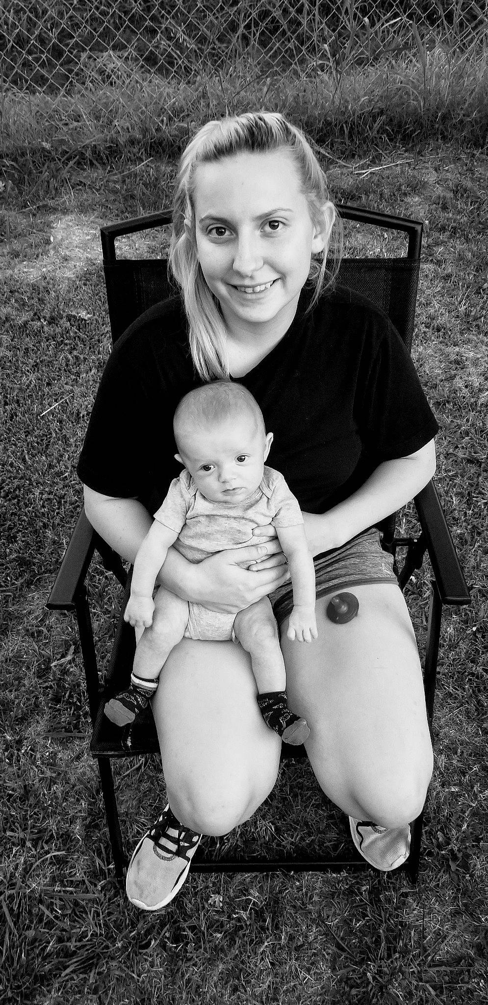 Ryker is registered to the contest to win money with this photo: abdomen, baby, black, black_and_white, child, family, grass, joy, leg, monochrome, monochrome_photography, people, person, photograph, photography, sitting, skin, smile, stock_photography, style
