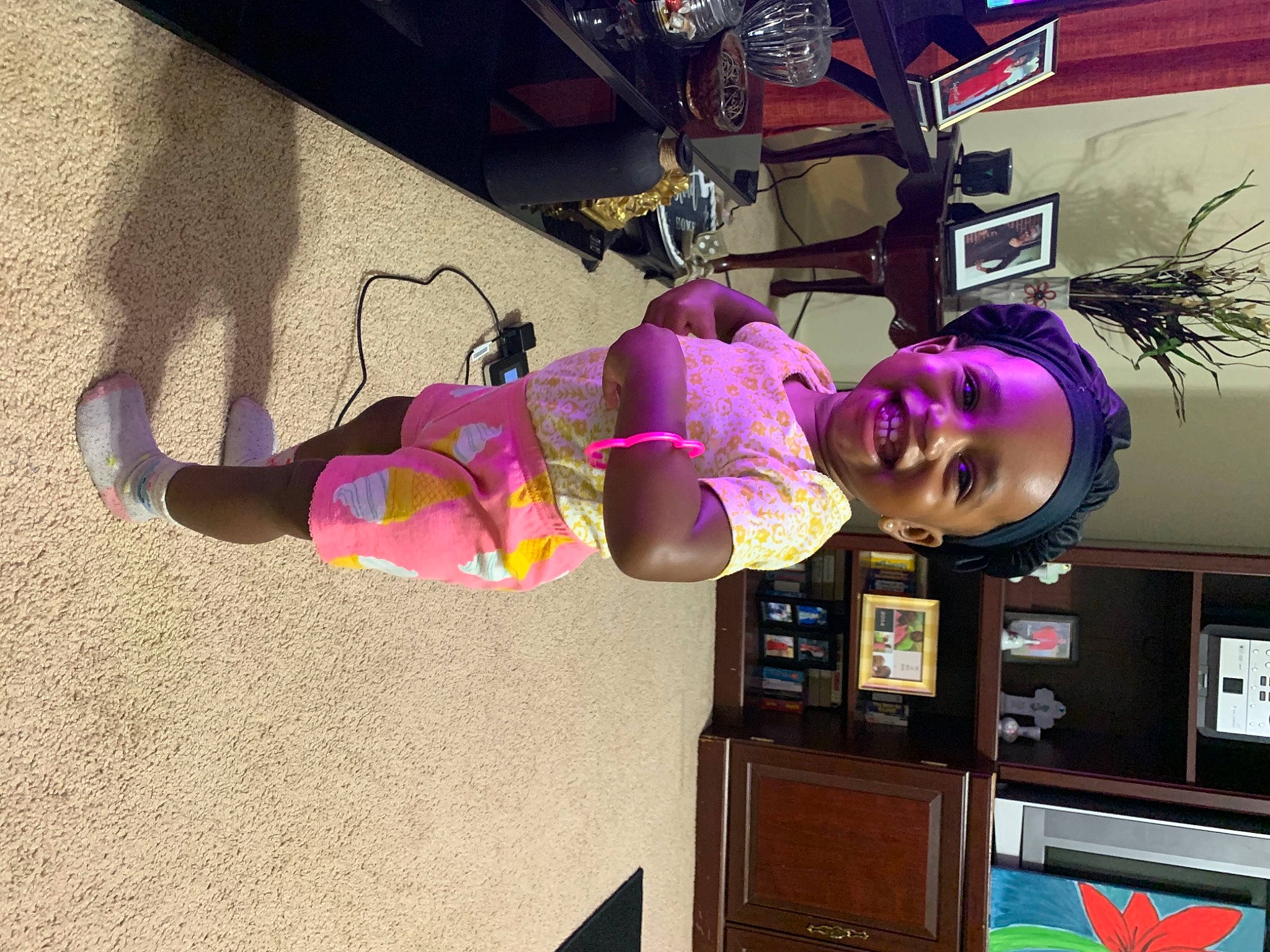 Danielle is registered to the contest to win money with this photo: cabinetry, costume, drawer, eyewear, fun, house, houseplant, joy, leisure, magenta, person, pink, plant, purple, room, shelving, smile, tire, tree, violet