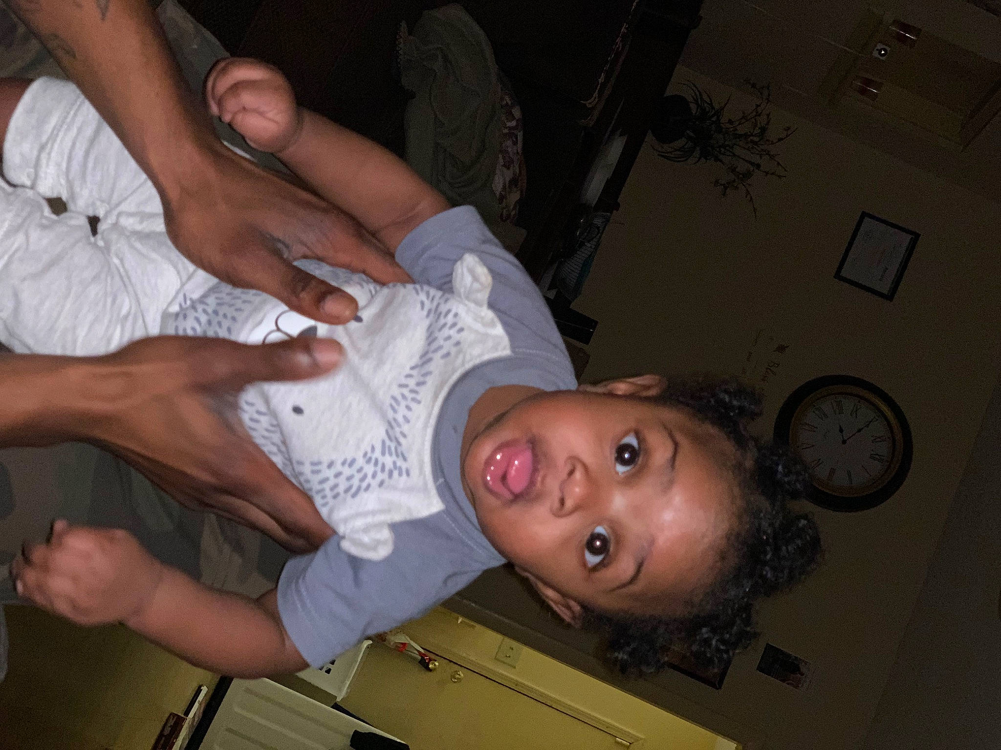 Montez is registered to the contest to win money with this photo: abdomen, chest, child, clock, comfort, ear, elbow, event, flesh, fun, gesture, hand, happy, human_leg, mouth, nail, person, room, surprise, thumb