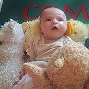 Imani joined the competition — help win amazing prizes! baby, infant, stuffed_animal, blanket, plush_toy, soft_toy, child, floor_mat, number_five, colorful, gazing, indoors, cute, young_child, cozy, comfort, play_area, toy, expression, person