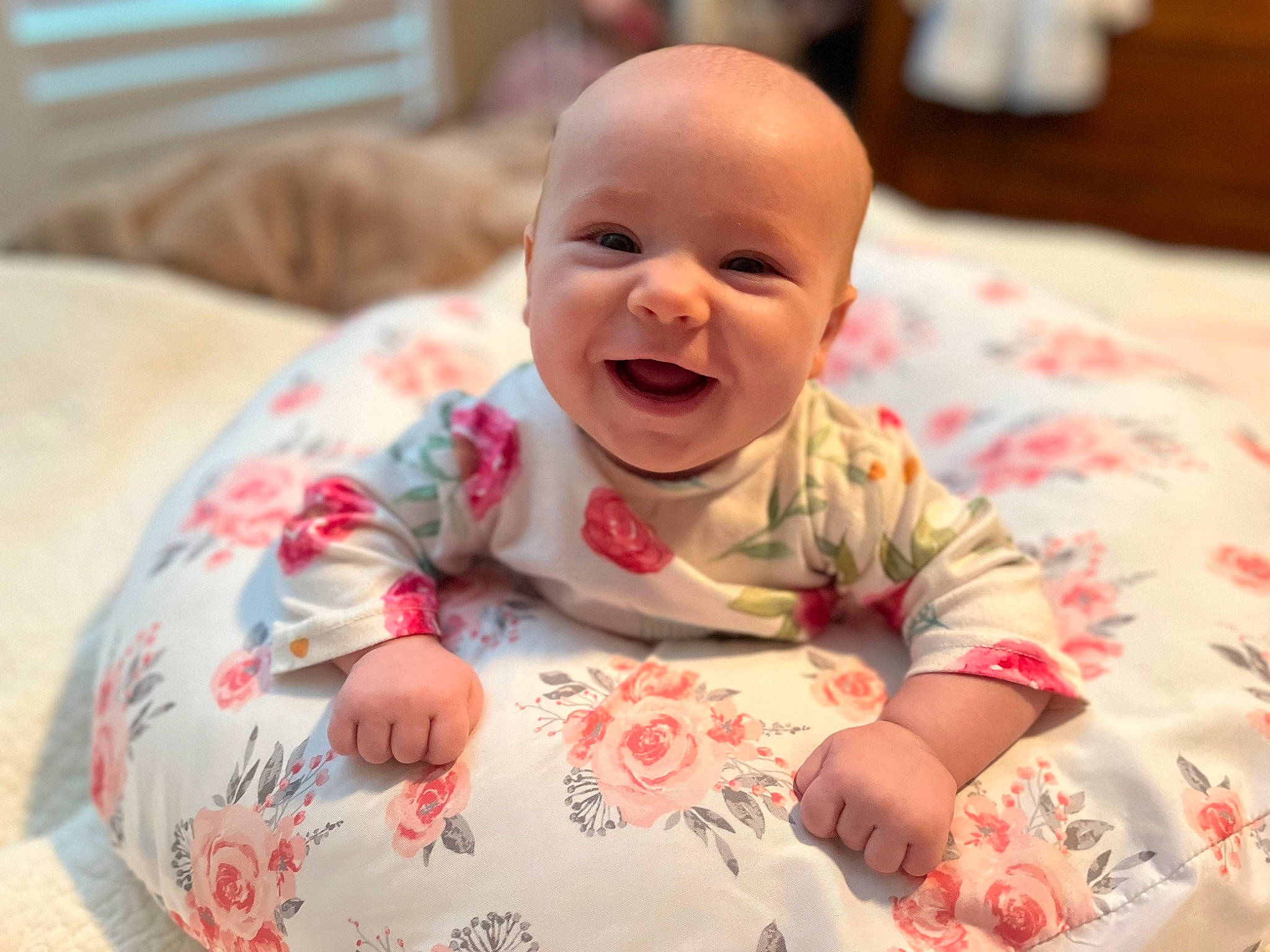 Katie joined the competition — help win amazing prizes! baby, baby_laughing, baby_toddler_clothing, cheek, child, comfort, dress, facial_expression, finger, happy, head, linens, mouth, nose, person, pink, product, skin, sleeve, smile