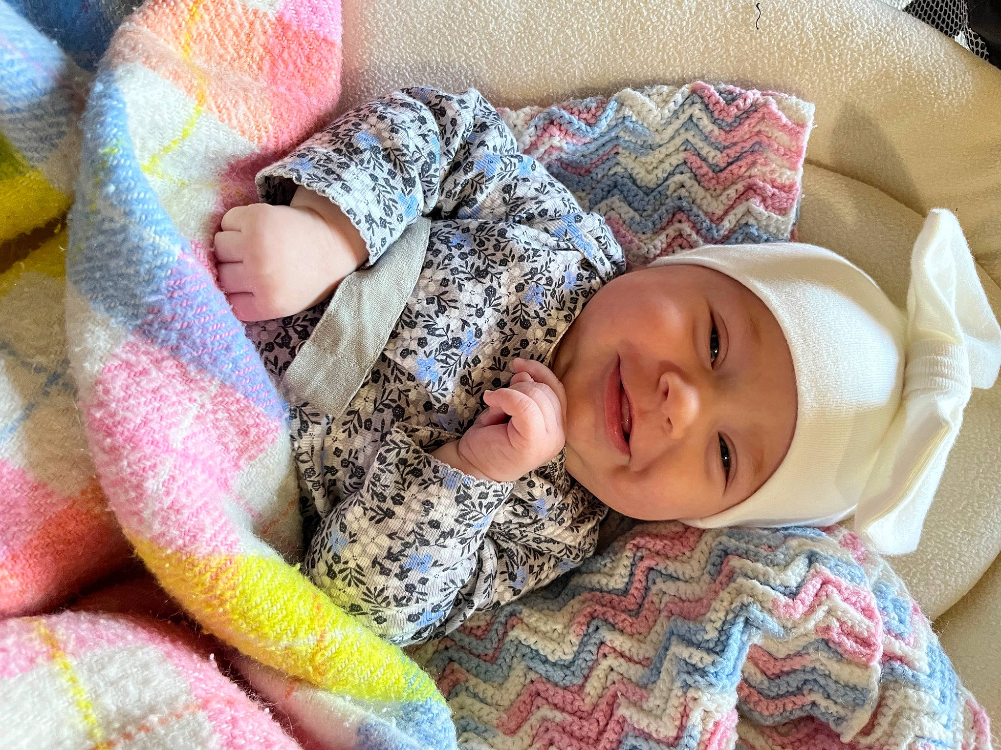 Katie joined the competition — help win amazing prizes! baby, baby_toddler_clothing, cheek, child, comfort, eye, facial_expression, finger, hand, happy, head, headwear, human_body, joy, linens, mammal, pattern, person, product, skin