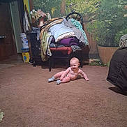 Sky joined the competition — help win amazing prizes! baby, carpet, indoor, chair, blanket, plant, pillow, floor, smiling, child, cozy, home, furniture, socks, room, decor, pot, clock, door, bucket