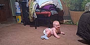Sky joined the competition — help win amazing prizes! baby, indoor, carpet, blankets, chair, clock, plant, wall_mural, crawling, diaper, socks, floor, furniture, cozy, smiling, child, home, decor, living_room, person