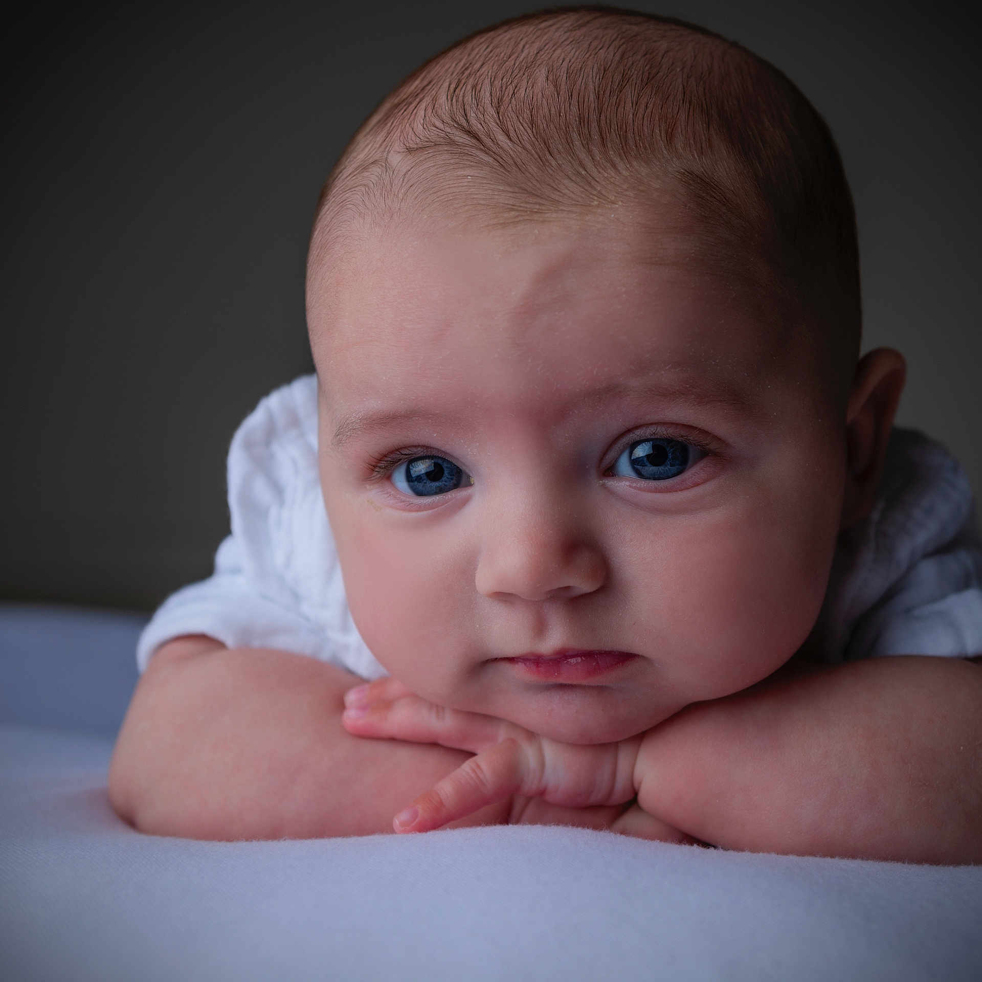 Isaac joined the competition — help win amazing prizes! baby, infant, face, blue_eyes, close_up, portrait, resting, arms, skin, expression, cute, child, newborn, soft_light, indoor, person, head, looking, young, peaceful