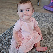 D'Alva joined the competition — help win amazing prizes! baby, child, pink_dress, carpet, floor, indoor, cute, smile, sitting, blue_eyes, person, toddler, soft_lighting, home, furniture, wood_floor, happy, portrait, infant, clothing