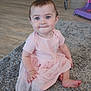 baby, child, pink_dress, carpet, floor, indoor, cute, smile, sitting, blue_eyes, person, toddler, soft_lighting, home, furniture, wood_floor, happy, portrait, infant, clothing