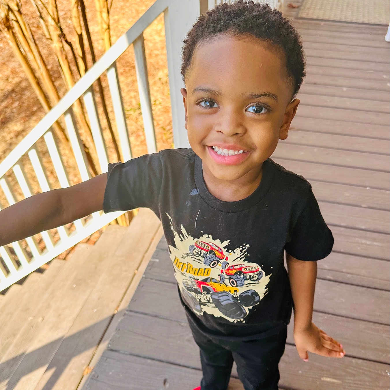 William is registered to the contest to win money with this photo: architecture, building, clothing, face, footwear, handrail, happy, head, house, housing, pants, person, photography, porch, portrait, shoe, smile, staircase, t_shirt, wood