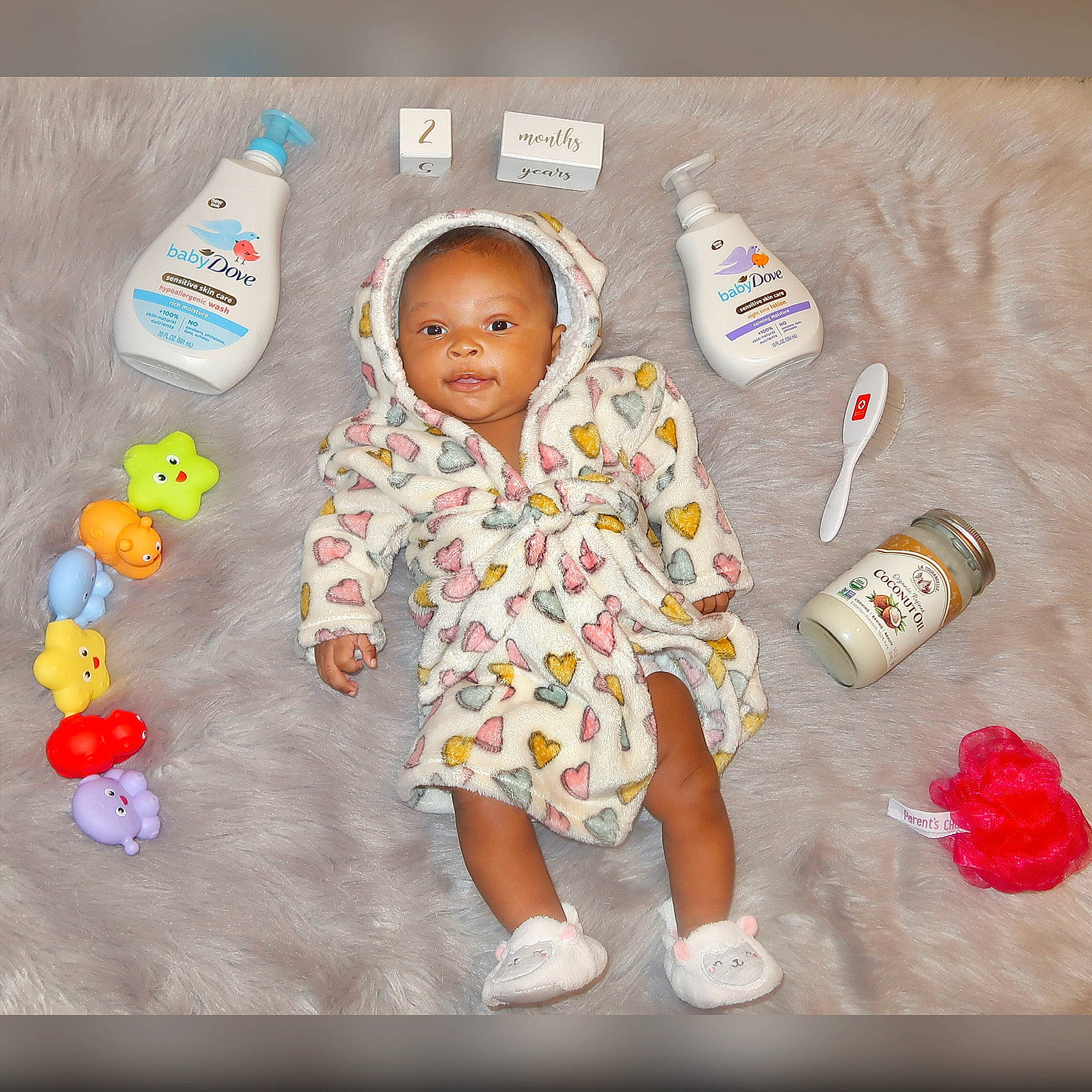 Malaya is registered to the contest to win money with this photo: baby, baby_products, baby_toddler_clothing, baby_toys, carmine, child, finger, flooring, fun, happy, linens, pattern, person, pink, play, room, sitting, sleeve, stuffed_toy, t_shirt