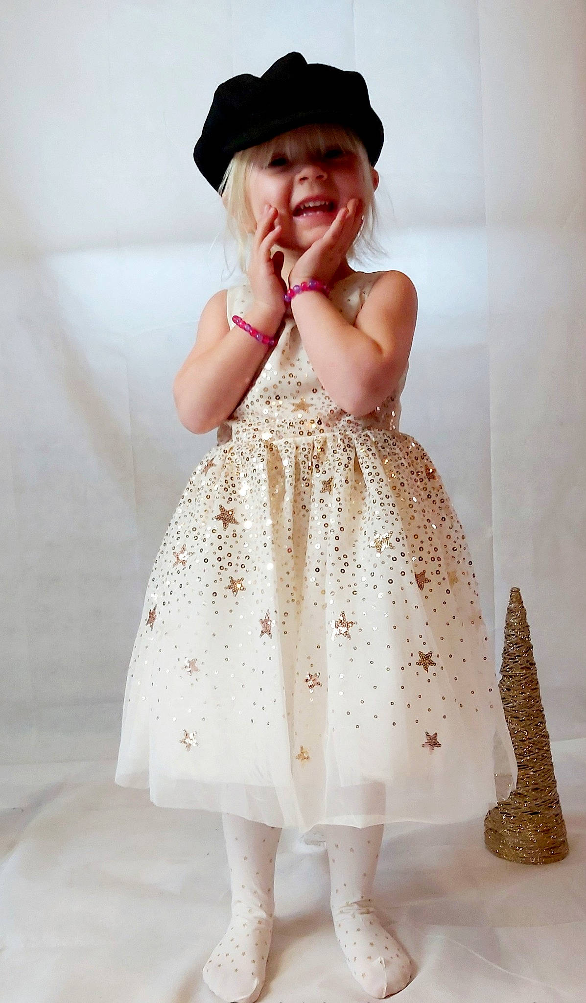 Heather participe au concours pour gagner de l'argent avec cette photo : baby, baby_toddler_clothing, child, child_model, clothing, costume_accessory, costume_hat, day_dress, dress, embellishment, fawn, hat, headgear, headwear, one_piece_garment, pattern, person, skin, sleeve, standing