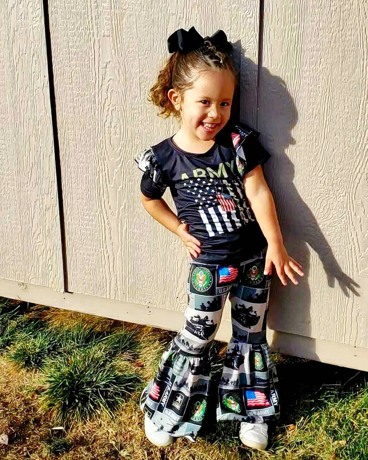 Emry is registered to the contest to win money with this photo: arm, baby_toddler_clothing, child, cool, electric_blue, fun, grass, happy, human_leg, joy, knee, leg, pattern, people_in_nature, person, shorts, sleeve, smile, t_shirt, thigh