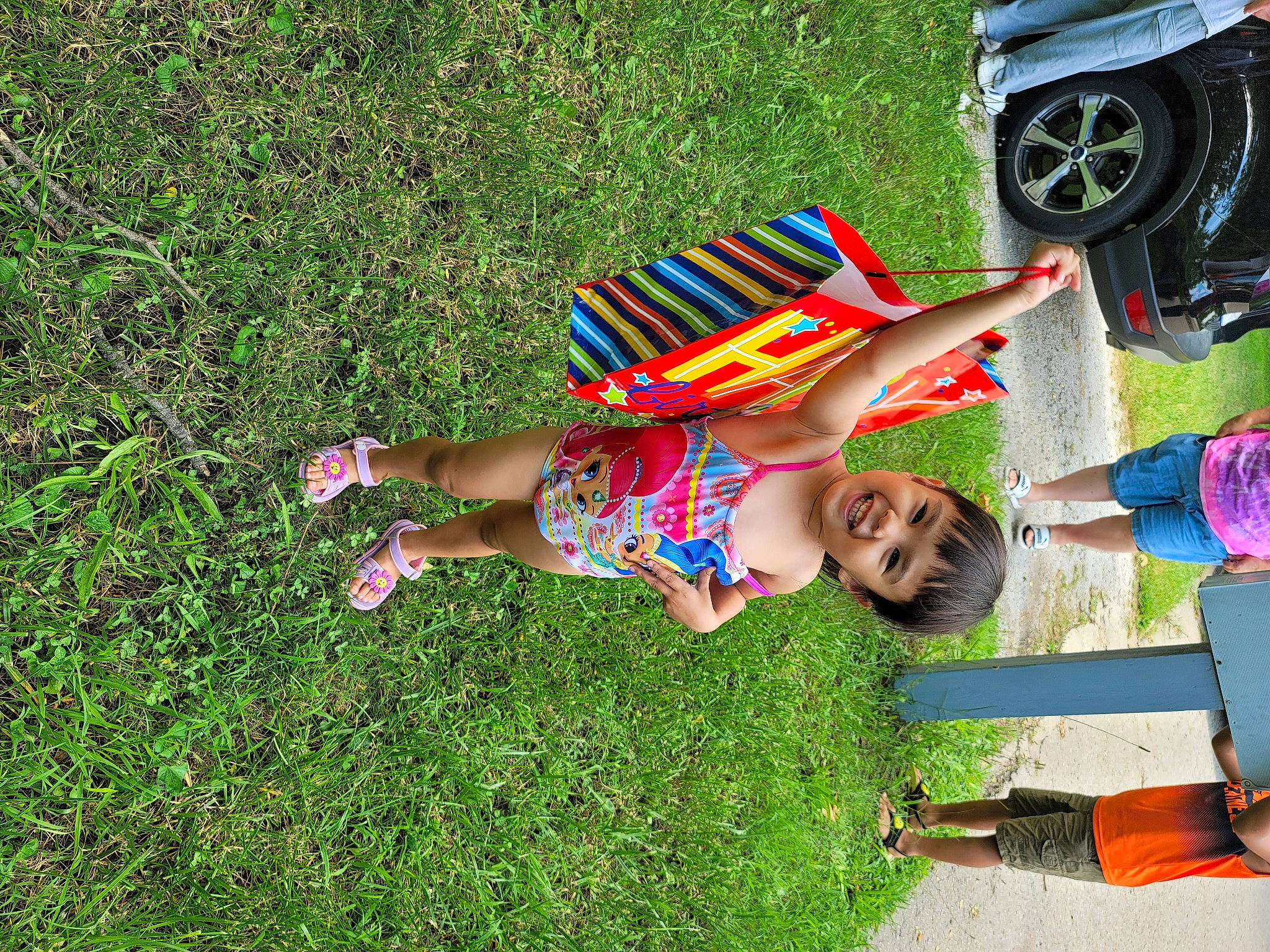 Athena joined the competition — help win amazing prizes! automotive_tire, automotive_wheel_system, fender, fun, grass, grassland, happy, hat, joy, lawn, leisure, motor_vehicle, people_in_nature, person, recreation, shoe, shorts, sunglasses, tire, toy