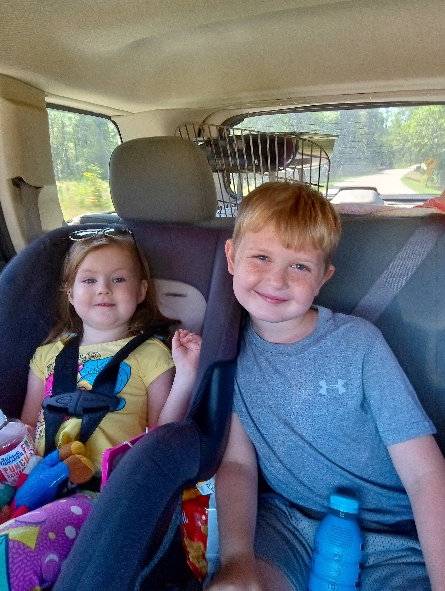 Daisy is registered to the contest to win money with this photo: auto_part, car, car_seat, car_seat_cover, family_car, fun, hair, happy, head_restraint, joy, leisure, motor_vehicle, person, plastic_bottle, seat_belt, smile, summer, toddler, vehicle, vehicle_door