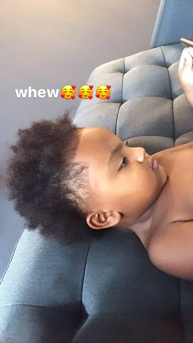 Zaiden is registered to the contest to win money with this photo: abdomen, baby, black_hair, chest, comfort, doll, eye, eyelash, gesture, hand, head, human_body, linens, lip, neck, person, skin, textile, toddler, toy